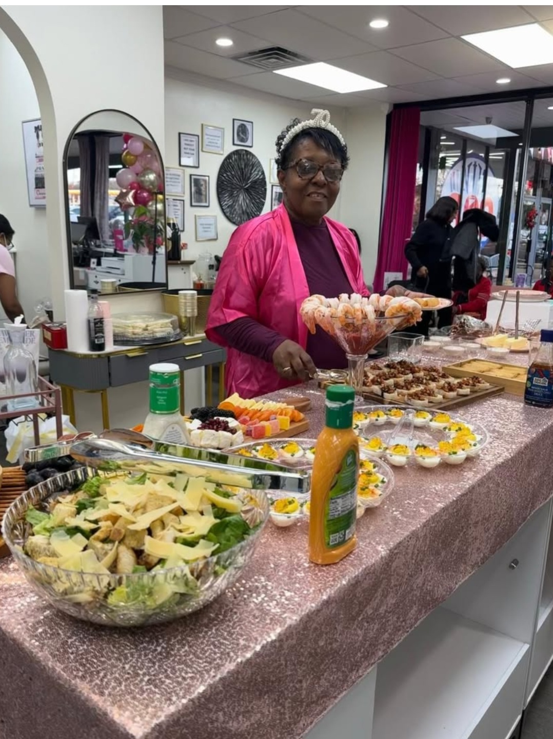 Spa party food spread — shrimp cocktail, deviled eggs, fresh fruit and appetizers