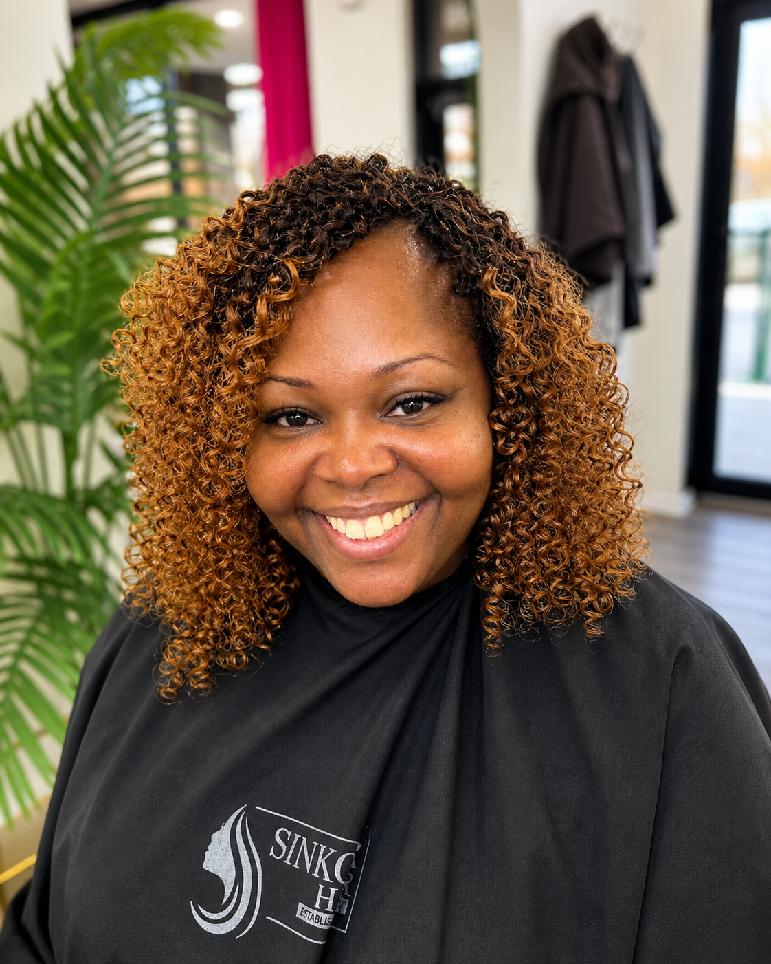 Honey caramel curly highlights at Sinkor Beauty Salon